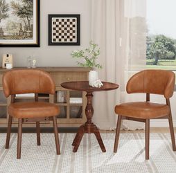 2 wood dining chairs with comfy brown leather