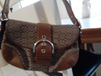 Carteras coach tamaño pequeña