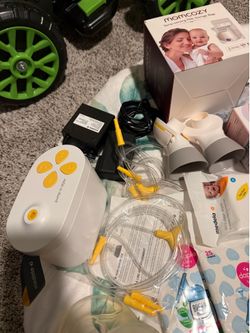 Medela Pump in Style, BOON, Momcozy storage bags, flange inserts