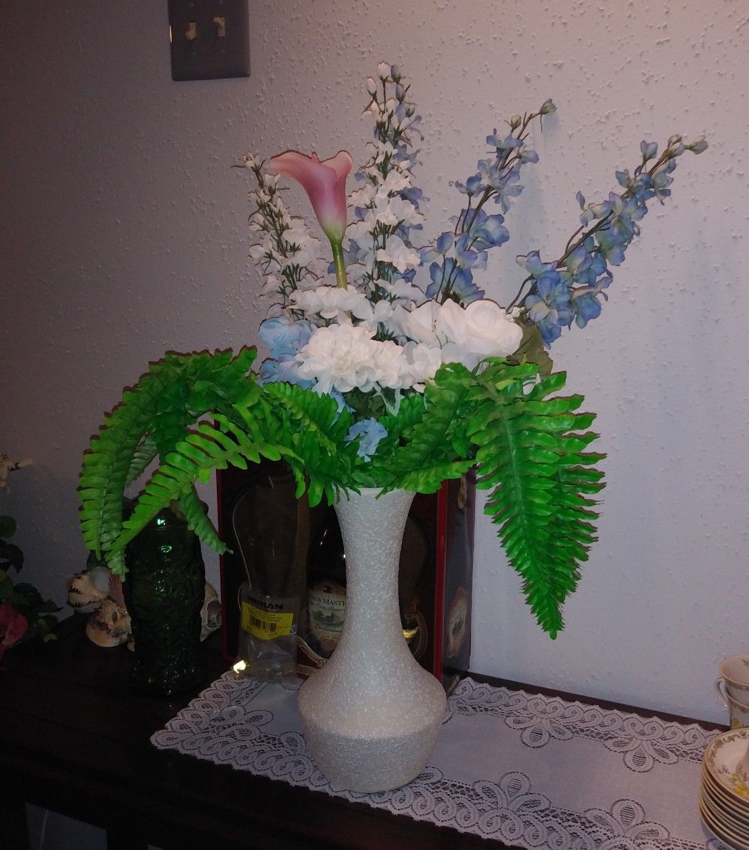 Beautiful flowers in white vase