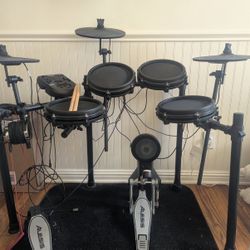 Alesis Electronic Drum Kit including drum sticks and headphones 