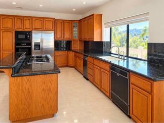 Real hardwood cabinets, granite countertops and appliances