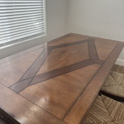 Pier one imports dinning room table with 2 chairs and a bench seat