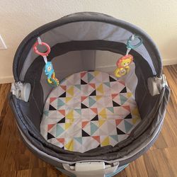 Fisher-Price Portable Bassinet and Play Space On-the-Go Baby Dome with Developmental Toys and Canopy