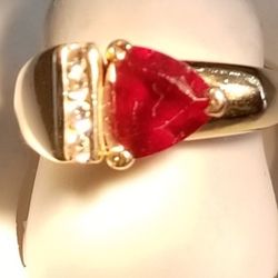 Ring With Trillion Center Stone And Diamonds 