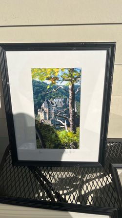 framed photograph of Eltz Castle (Burg Eltz), a medieval hill castle nestled in the hills above the Moselle river in Wierschem, Germany