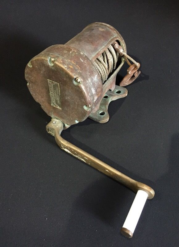 Antique Merriman Bros. Inc. bronze winch with handle.