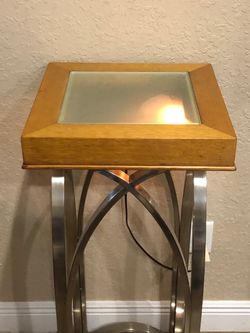 modern pedestal display stand with built-in under-lighting.