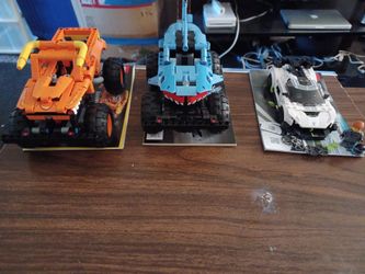 3 complete Lego cars with instructions to assemble.