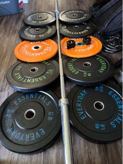 Bumper weights with collar locks and 7 ft 45 lb barbell 2x45, 2x25, 2x15 and 4x10 lbs