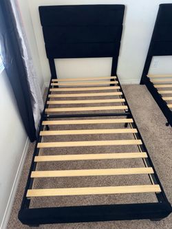 Two twin sized bed frames for sale