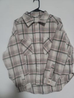 Cream Heavy Flannel Shacket with a pink and grey plaid pattern.