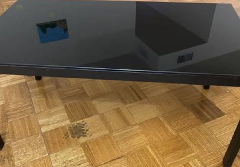 Black Coffee Table - Glass. Excellent used condition, and great for any room! Measurements: 31.5" (length) x 18" (width) x 15" (height)