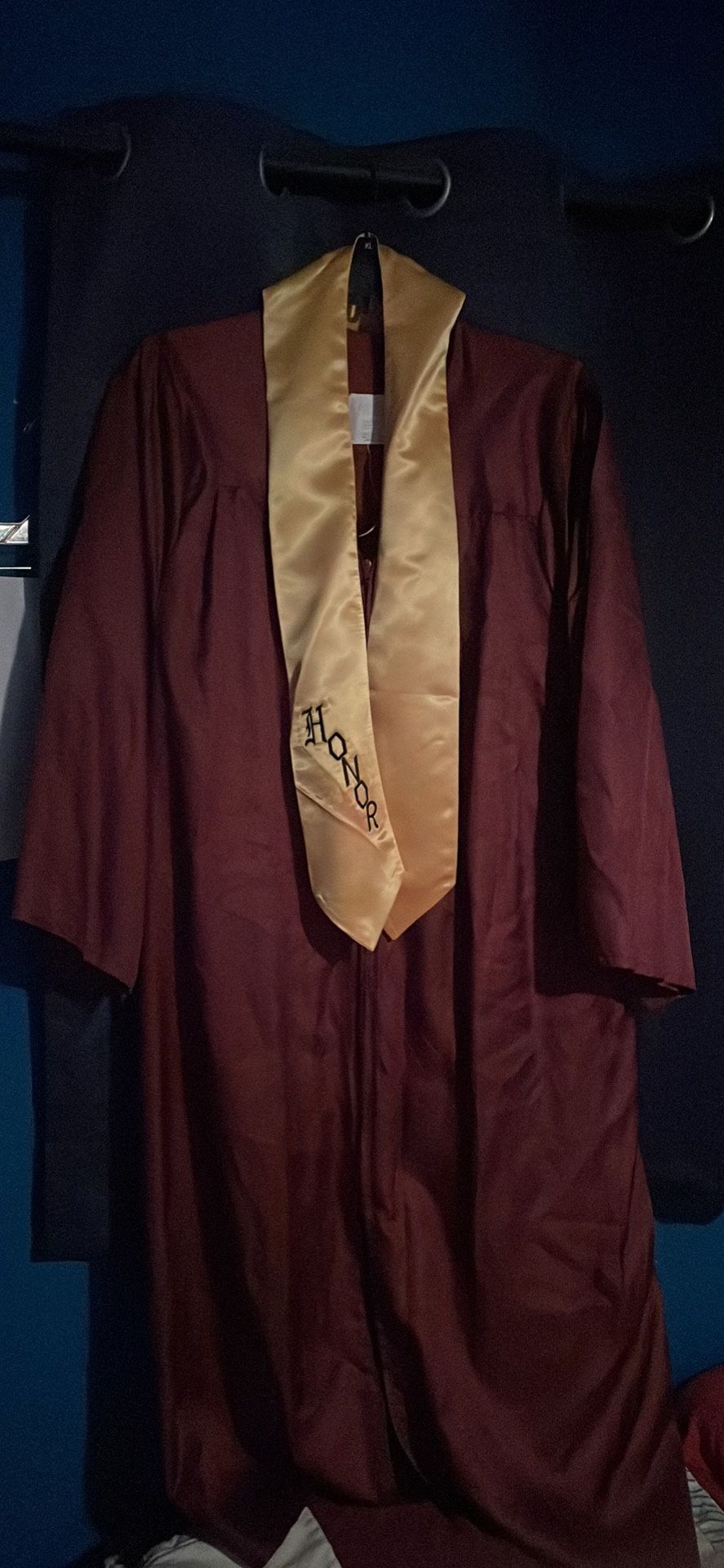 Red Cap And Gown With Gold Sash