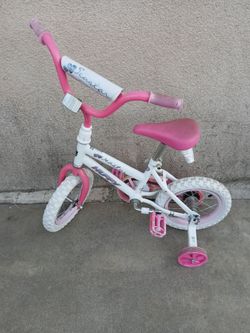 Huffy kids girl bike with training wheels