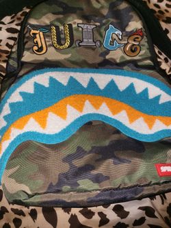 Backpack Sprayground $ PATTERN OVER CAMO SLING BACKPACK Green