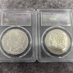 2 Morgan silver dollars (1883CC. 1893CC)