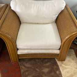 Set of classic wicker chairs and matching ottomans