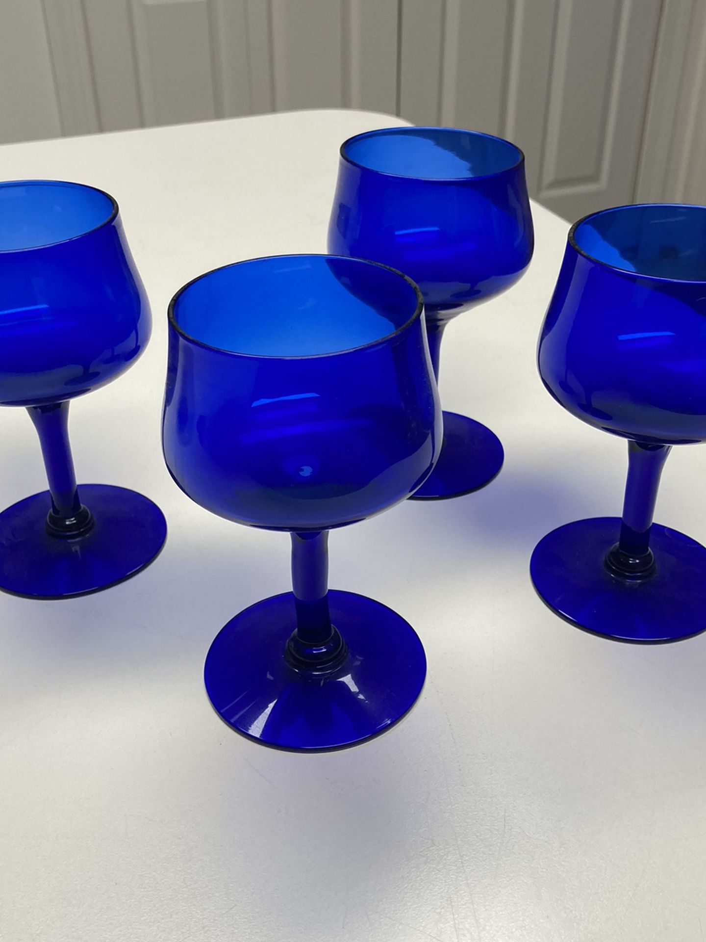 4 blue vintage wine glasses