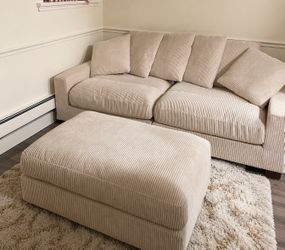 Cream corduroy sofa with matching oversized ottoman in great condition