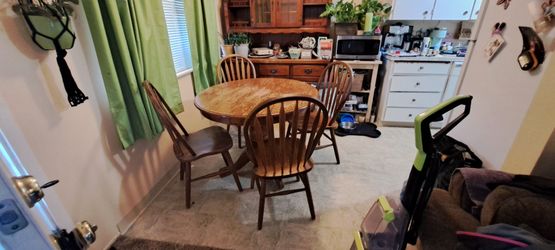 Kitchen table with leaf (not pictured) and 4 sturdy chairs