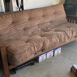 Queen-sized futon with solid hardwood frame and microsuede mattress