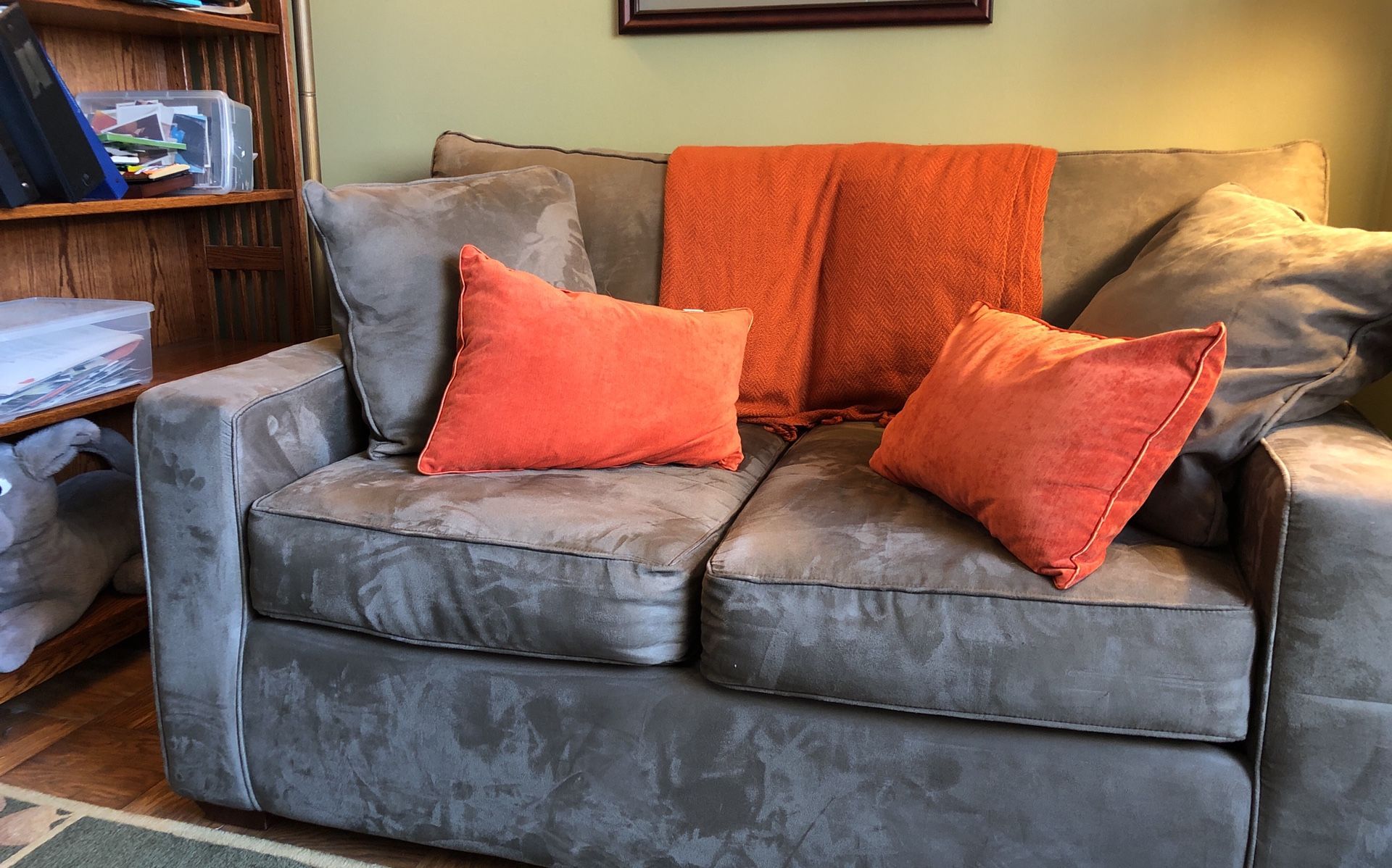 Love seat with pillows and throw