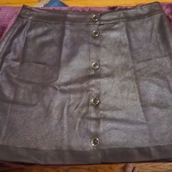 NEW Michael Kors Brown Suade Skirt.  Size 12.  Waist is approximately 18.25" across and 19.25" in length.  Double Layered.  NWOT.  Absolutely Beautifu