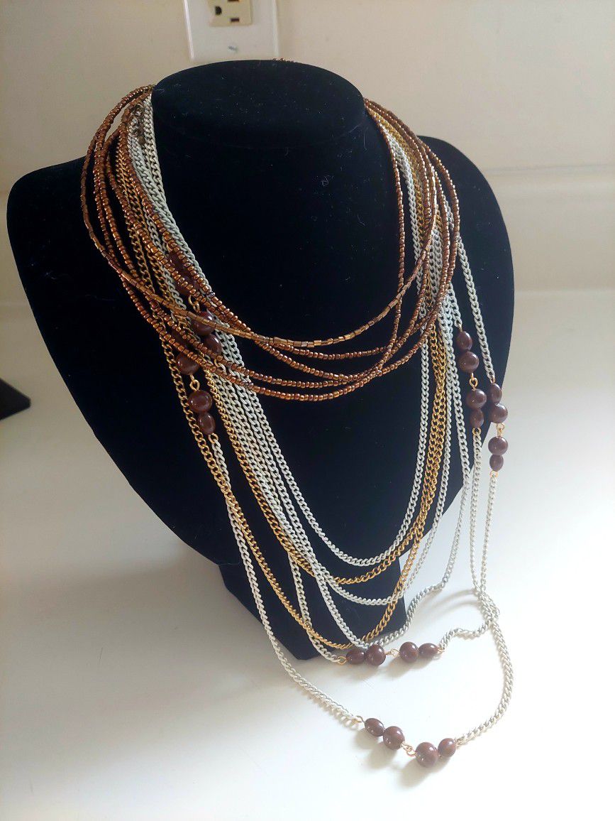 Set of 3 Brown and Cream Colored Necklaces. 54" Cream Chain Necklace w/Brown Wooden Beads, an Elegant 24" Multi-Strand Cream & Gold Chain and a Brown 