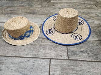 Pair of womens straw sun hats