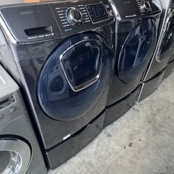 Black stainless color Front load Samsung washer and front load Samsung dryer electric with pedestals 