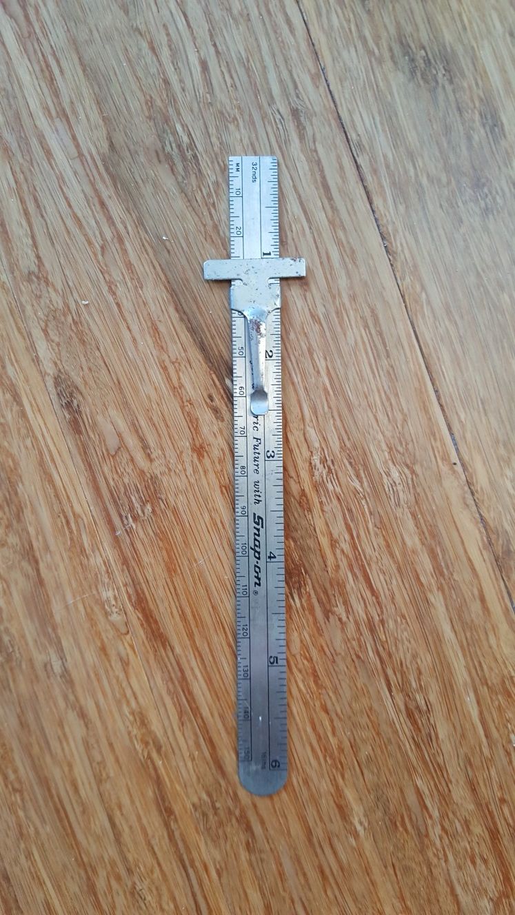 Snap on pocket ruler with metric conversion