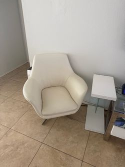 Fine, leather swivel chair and matching table