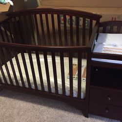 Crib/ changing table/ toddler bed And Dresser