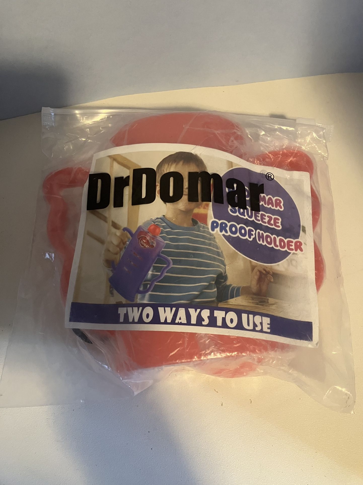 Dr. Domar Squeeze Proof Holder For Juices. New. Red