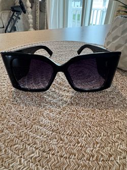 Woman’s black sunglasses