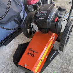 Weed eater like new with extra string.