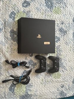 PS4 PRO with two controllers ( GREAT CONDITION)