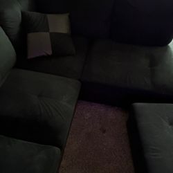 Black Sectional With Ottoman And 2 Pillows