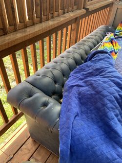 Chesterfield-style leather sofa