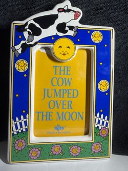 The vintage Russ Berrie "The Cow Jumped Over the Moon" ceramic 4x6 photo frame