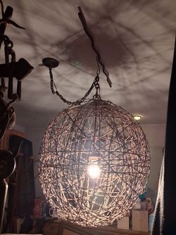 Unique handcrafted rustic barbed wire hanging light