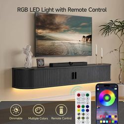 55" Floating TV Stand with Power Outlet for TVs up to 65", Black Fluted Entertainment Center with Remote Control for LED Lights, Mid-Century Modern T