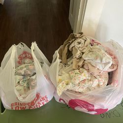  two bags of baby clothes 