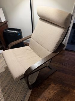 Lightly used IKEA Poang chair. Dark brown with beige upholstery.