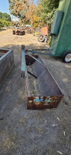 Tractor box scraper