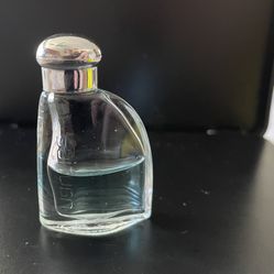 Mini bottle of Nautica cologne for men 3.4 Ml 1/2 Full. 