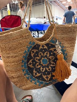 Antik Kraft woven jute tote bag featuring a bold blue and black medallion print