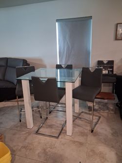 Public style glass top table with chairs / stools