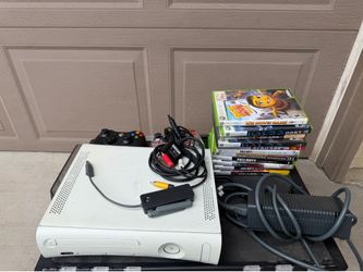 Xbox 360 with games controllers cords